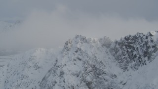 4K aerial stock footage snow covered mountain summit, Knik River Valley, Chugach Mountains, Alaska Aerial Stock Footage | AK0001_1569