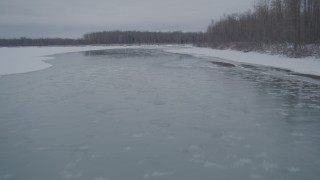 4K aerial stock footage following an icy river, Knik River Valley, Alaska in snow Aerial Stock Footage | AK0001_1600