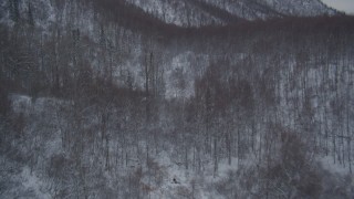 4K aerial stock footage flying over snow covered, wooded hills at base of Chugach Mountains, Alaska Aerial Stock Footage | AK0001_1620