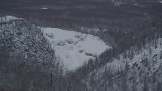 AK0001_1625 - 4K aerial stock footage snow covered quarry and digging equipment, Chugiak, Alaska