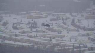 4K aerial stock footage helicopter flying over snow covered Fort Richardson, Anchorage, Alaska Aerial Stock Footage | AK0001_1638