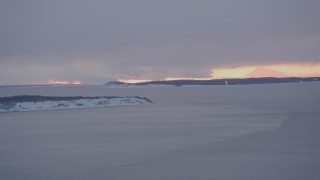 AK0001_1661 - 4K aerial stock footage snowy Fire Island, twilight lit clouds, Knik Arm of the Cook Inlet, Alaska