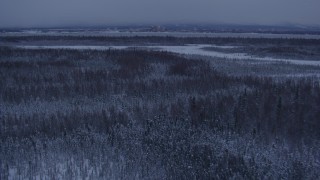 4K aerial stock footage Downtown Anchorage seen from snowy Point MacKenzie at twilight, Alaska Aerial Stock Footage | AK0001_1679