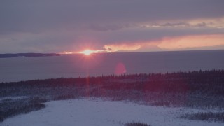 4K aerial stock footage the twilight and clouds seen from snow covered Point MacKenzie, Alaska Aerial Stock Footage | AK0001_1683