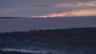 AK0001_1685 - 4K aerial stock footage twilight lit clouds seen from snow covered Point MacKenzie, Alaska