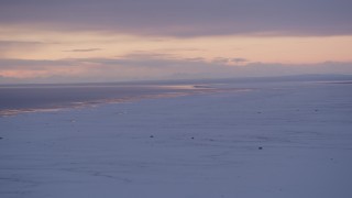 4K aerial stock footage twilight lit clouds over snow covered Point MacKenzie and Cook Inlet, Alaska Aerial Stock Footage | AK0001_1691