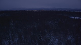 4K aerial stock footage revealing Downtown Anchorage skyline, winter, Point MacKenzie, Alaska, night Aerial Stock Footage | AK0001_1716