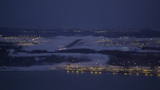 4K aerial stock footage snow covered Elmendorf Air Force Base at night, Anchorage, Alaska Aerial Stock Footage | AK0001_1719