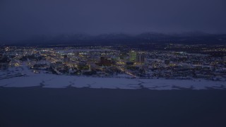 4K aerial stock footage snow covered Downtown Anchorage at night, Alaska Aerial Stock Footage | AK0001_1720