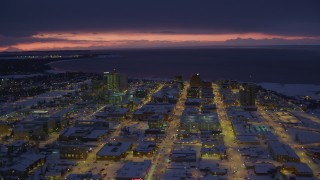 4K aerial stock footage a view of snow covered Downtown Anchorage at night, Alaska Aerial Stock Footage | AK0001_1725