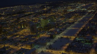 AK0001_1735 - 4K aerial stock footage snow covered Downtown Anchorage and Merrill Field at night, Alaska