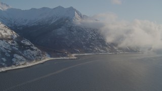 4K aerial stock footage flying over the Turnagain Arm of the Cook Inlet, Alaska in snow Aerial Stock Footage | AK0001_1739