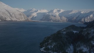 4K aerial stock footage fly along snowy shore of Harriman Fjord toward Chugach Mountains, Alaska Aerial Stock Footage | AK0001_1789