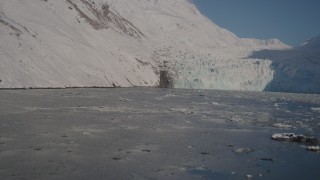 AK0001_1797 - 4K aerial stock footage flying low over surface of Harriman Fjord toward glacier, Alaska