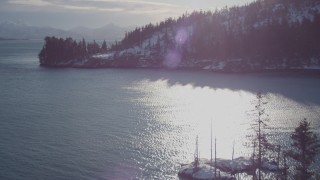 AK0001_1835 - 4K aerial stock footage flying over small, snowy island in Port Wells, Alaska