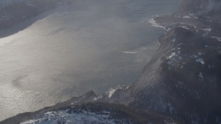 4K aerial stock footage the windblown Passage Canal near a snowy, hilly valley, Alaska Aerial Stock Footage | AK0001_1912