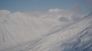 4K aerial stock footage snowy mountains and low clouds, Chugach Mountains, Alaska Aerial Stock Footage | AK0001_1917