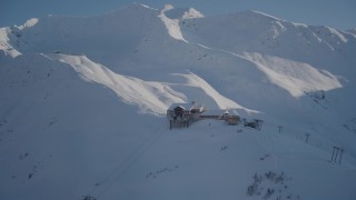 4K aerial stock footage snow covered ski lodge and ski lift at summit of mountain, Girdwood, Alaska Aerial Stock Footage | AK0001_1966