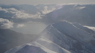 4K aerial stock footage snowy Kenai Mountains across the Turnagain Arm of the Cook Inlet, Alaska Aerial Stock Footage | AK0001_1984