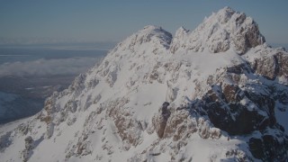 4K aerial stock footage flying over snowy summit of a peak in the Chugach Mountains, Alaska Aerial Stock Footage | AK0001_1993