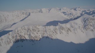 4K aerial stock footage flying by snow covered Chugach Mountains, Alaska Aerial Stock Footage | AK0001_1994