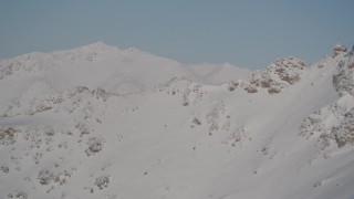 4K aerial stock footage descending past a mountain slope in the Chugach Mountains, Alaska Aerial Stock Footage | AK0001_1998