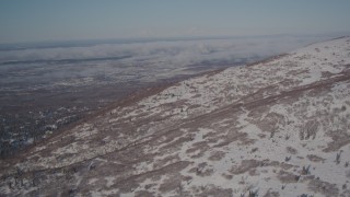 4K aerial stock footage flying near a snowy mountain slope in the Chugach Mountains, Alaska Aerial Stock Footage | AK0001_2004