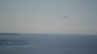 4K aerial stock footage a passenger jet soaring over the Cook Inlet, Anchorage, Alaska in snow Aerial Stock Footage | AK0001_2019