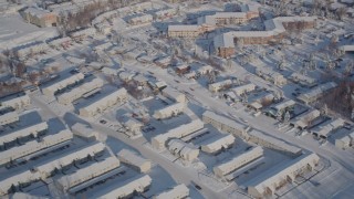 4K aerial stock footage flying over snow apartment buildings in Anchorage, Alaska Aerial Stock Footage | AK0001_2026