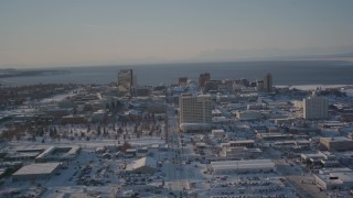 4K aerial stock footage ascending over buildings in snow covered Downtown Anchorage, Alaska Aerial Stock Footage | AK0001_2029