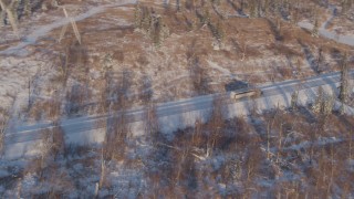 4K aerial stock footage flying toward a rural highway in Point MacKenzie, Alaska in snow Aerial Stock Footage | AK0001_2044