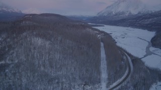 4K aerial stock footage reveal snowy Matanuska River Valley, Chugach Mountains at sunset, Alaska Aerial Stock Footage | AK0001_2110