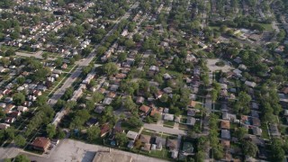 AX0001_003 - Aerial stock footage of 4.8K aerial  video flying over residential neighborhoods in Calumet City, Illinois, and reveal a shopping center