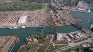 4.8K aerial stock footage  flying away from bridges over the Calumet River and warehouse buildings, East Side and South Chicago, Illinois Aerial Stock Footage | AX0001_008