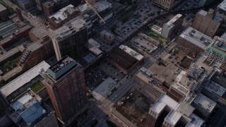 4.8K aerial stock footage tilt up from downtown parking lots and buildings to reveal Willis Tower, Downtown Chicago, Illinois Aerial Stock Footage | AX0001_024