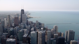 4.8K aerial stock footage panning across downtown skyscrapers beside Lake Michigan in Downtown Chicago, Illinois Aerial Stock Footage | AX0001_037