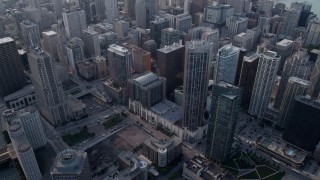 4.8K aerial stock footage tilt from Downtown Chicago skyscrapers to Chicago River, on a hazy day, Illinois Aerial Stock Footage | AX0001_038