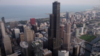 4.8K aerial stock footage tilt from the Chicago River to reveal Willis Tower in Downtown Chicago, Illinois Aerial Stock Footage | AX0001_045