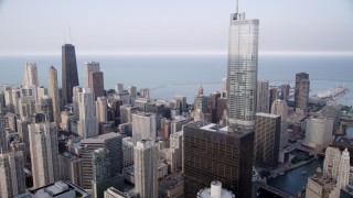 4.8K aerial stock footage following the Chicago River, tilt up revealing Trump Tower and John Hancock Center, Downtown Chicago, Illinois Aerial Stock Footage | AX0001_048