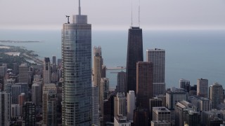 4.8K aerial stock footage of John Hancock Center, Trump International Hotel and Tower, Downtown Chicago, Illinois Aerial Stock Footage | AX0001_053