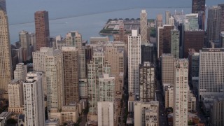 4.8K aerial stock footage flying by a group of high-rises and skyscrapers, Downtown Chicago skyscrapers, Illinois Aerial Stock Footage | AX0001_055