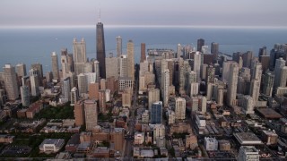 4.8K aerial stock footage of Downtown Chicago skyscrapers on a cloudy day, Illinois Aerial Stock Footage | AX0001_056