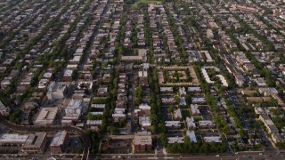 4.8K aerial stock footage video tilt from homes in the North part of Chicago to reveal apartment buildings, on a hazy day, Chicago, Illinois Aerial Stock Footage | AX0001_057