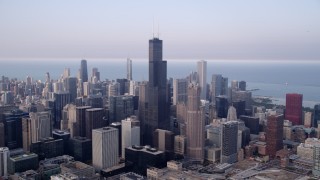 4.8K aerial stock footage Downtown Chicago skyscrapers around Willis Tower on a hazy day; Chicago, Illinois Aerial Stock Footage | AX0001_071