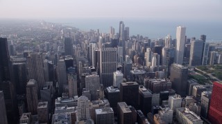 4.8K aerial  video approach Downtown Chicago skyscrapers on a hazy day, Illinois Aerial Stock Footage | AX0001_081