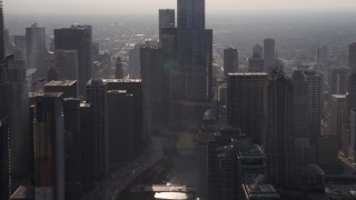 4.8K aerial stock footage passing the Chicago River and downtown skyscrapers on a hazy day, Downtown Chicago, Illinois Aerial Stock Footage | AX0001_093