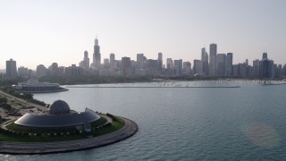 4.8K aerial stock footage approach downtown skyline and harbor from Adler Planetarium, Downtown Chicago, Illinois Aerial Stock Footage | AX0001_100