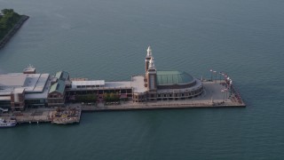 4.8K aerial stock footage orbiting the end of the Navy Pier on Lake Michigan, Chicago, Illinois Aerial Stock Footage | AX0001_123