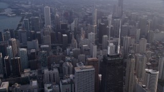 4.8K aerial stock footage of the top of John Hancock Center and Downtown Chicago skyscrapers, on a hazy day, Illinois Aerial Stock Footage | AX0001_127