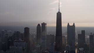 4.8K aerial stock footage tilt up from Lake Michigan to reveal John Hancock Center and skyscrapers, Downtown Chicago, Illinois Aerial Stock Footage | AX0001_129